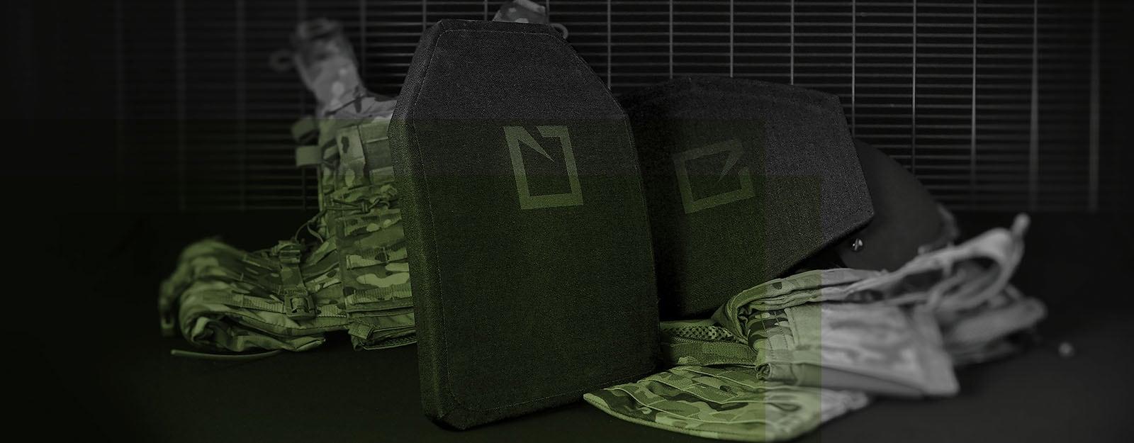 HESCO 800 Series plates standing beside folded multicam gear