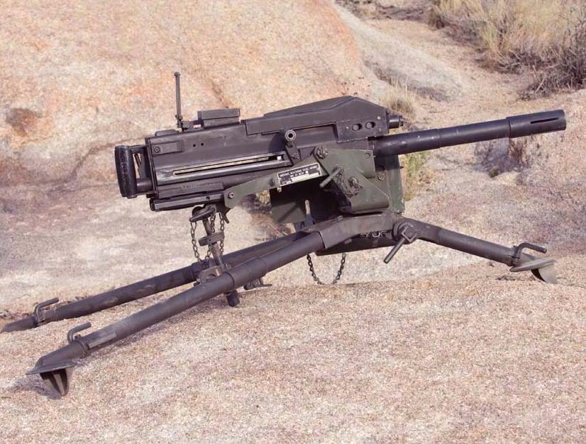 MK19 grenade machine gun on a tripod in a desert setting